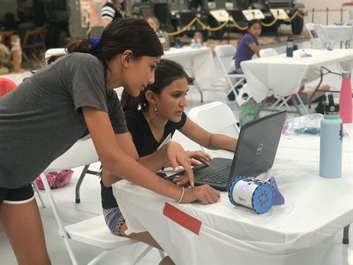 girls looking at computer